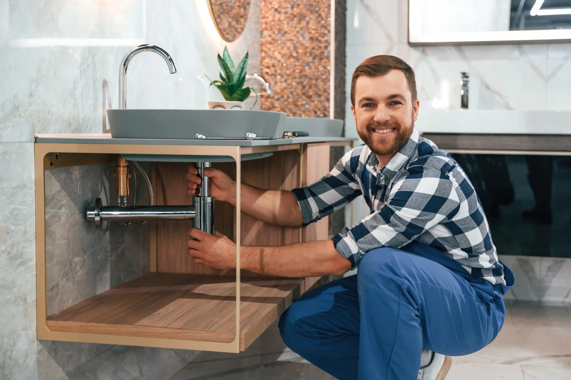 plumber-in-blue-uniform-is-at-work,webp